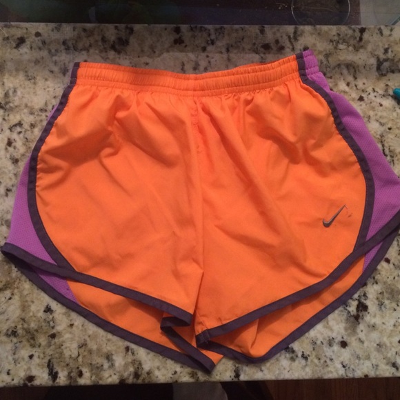 orange and purple nike shorts