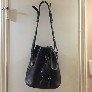 All black leather Dooney & Bourke purse.