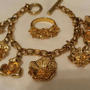 Goldtone floral charm bracelet/ring.