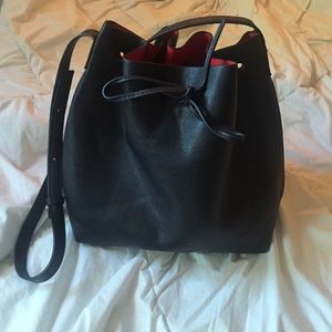 Black bucket leather purse