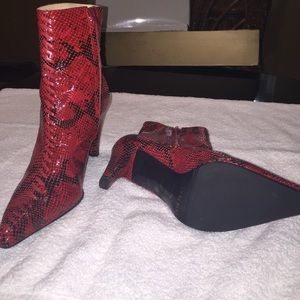 Red and black ankle high boots with heels