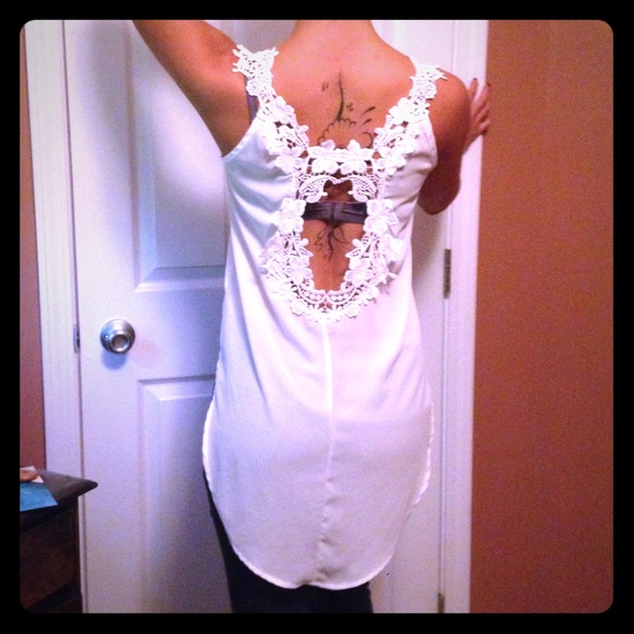 Long in the back crop in the front white blouse.