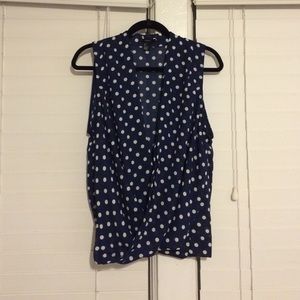 Navy blue blouse with white polka dots.