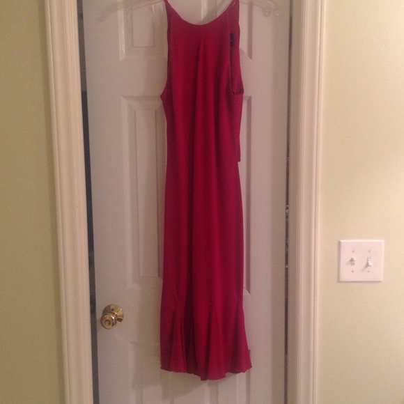 Fuchsia dress w/bottom kick pleats.