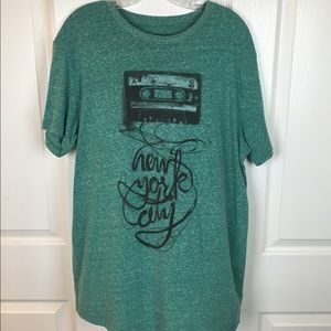 A green shirt that fits comfortable and is soft.