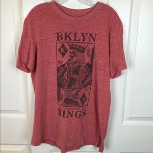 A red shirt that has only been wore once.