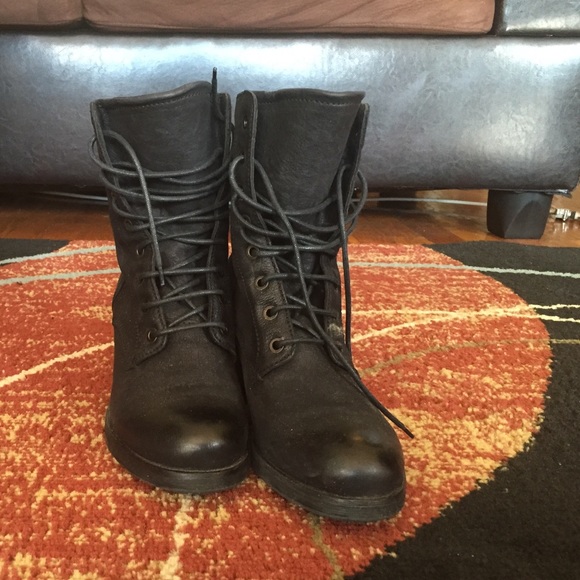 Stacked heel black combat boots.