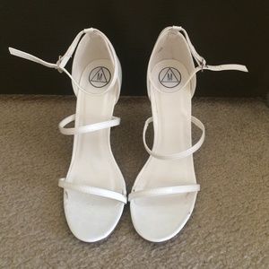 Strappy white heels