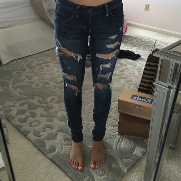 Blue jeans with rips in front