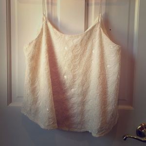 White sequin top with float features.
