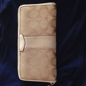 White and beige Coach wallet