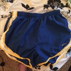 blue and yellow Nike shorts