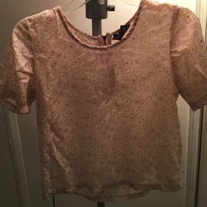 A light pink blouse with flowers