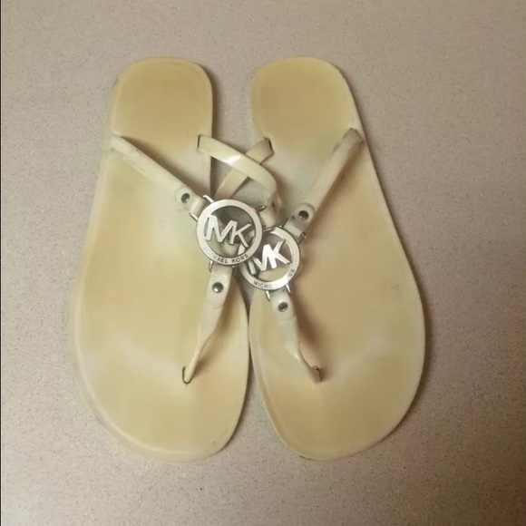 2 pair mk flip flops. Both size 10. - Picture 1 of 4