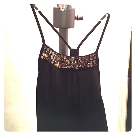 A high neck black top with beads
