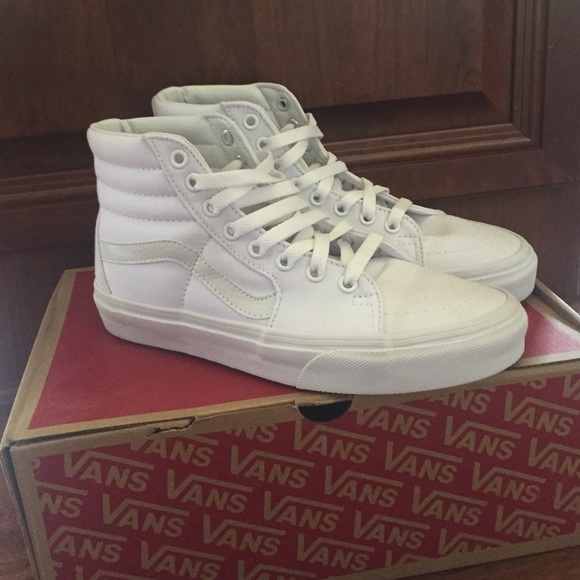 All white Vans high tops