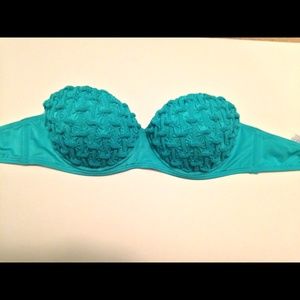Strapless turquoise bathing suit.