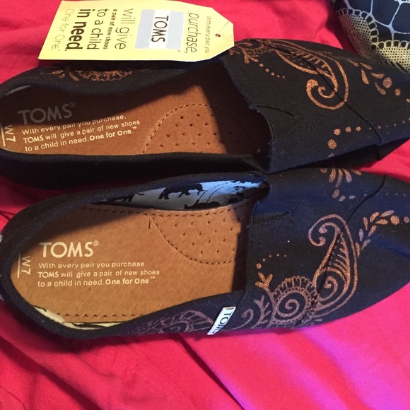 Black painted TOMs shoes