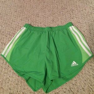 Green running shorts