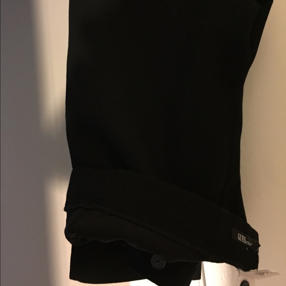 Guess black slacks by the guess collection.