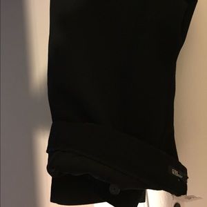 Guess black slacks by the guess collection.