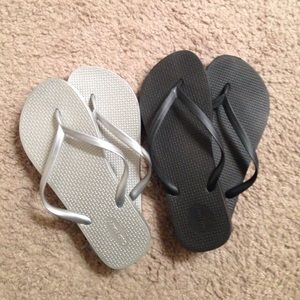 Pair of silver and black flip flops