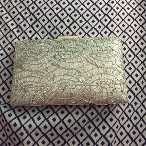 Silver clutch with detail on front
