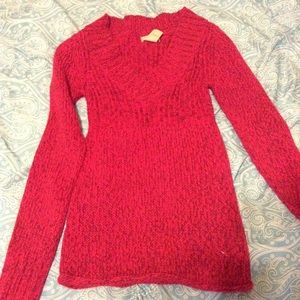 Pink sweater with burgundy and silver specks.