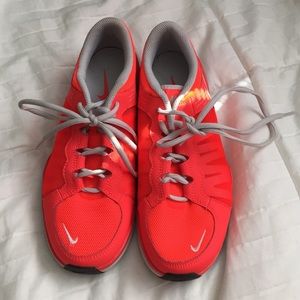 Orange Nike running shoes