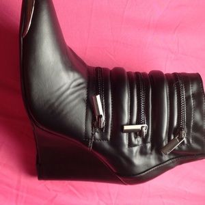 Brand new leather black booties.