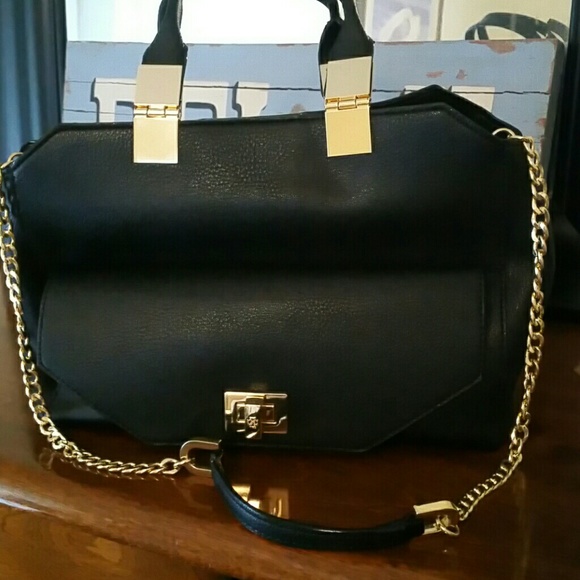 New from Banana Republic.  Black leather with gold