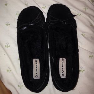 Black moccasins .
