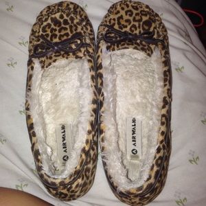 Cheetah print moccasins .