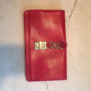 Red clutch with gold closure