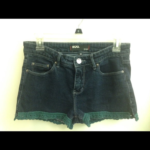 Cutoff jean shorts with crocheted trim