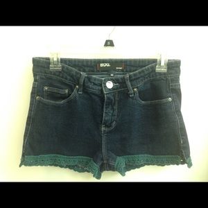 Cutoff jean shorts with crocheted trim