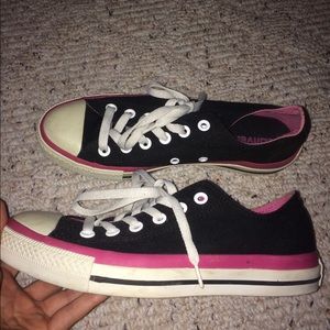 Pink and black converse