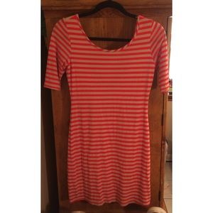 Orange and beige fitted dress.