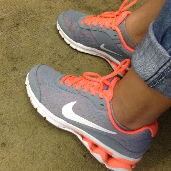 Grey, white, and hot pink Nike's