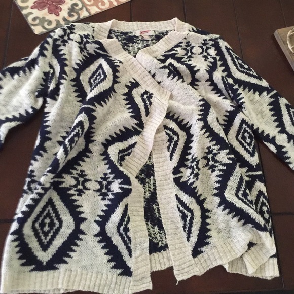 Navy blue and cream colored wrap sweater
