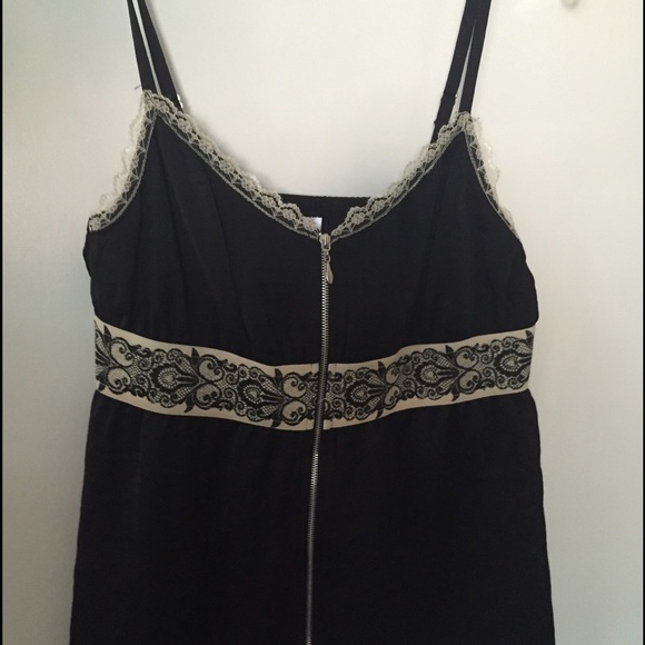 Black top with cream lace detail and front zipper