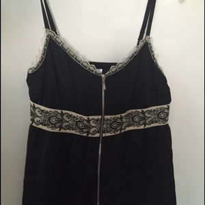 Black top with cream lace detail and front zipper