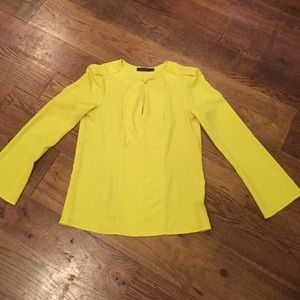 Mustard yellow silk shirt keyhole front detail