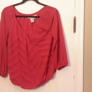 Red top with ribbon v pattern