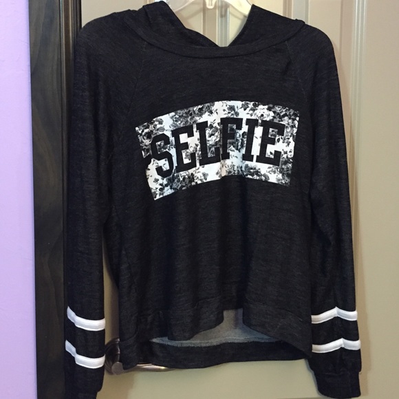 long sleeve, hooded, dark grey goodie shirt.