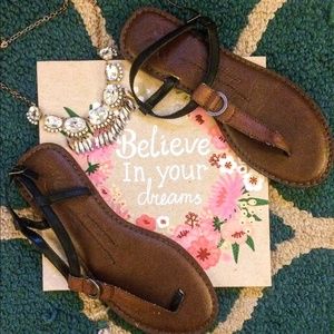 Brown and black american eagle sandals.