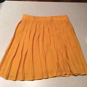 Orange pleated skirt