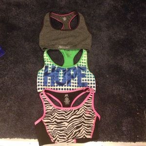 3 Justice sports bras. 2 are size 30. I size 32