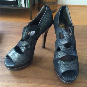 Black high heel, metallic platforms by Isola