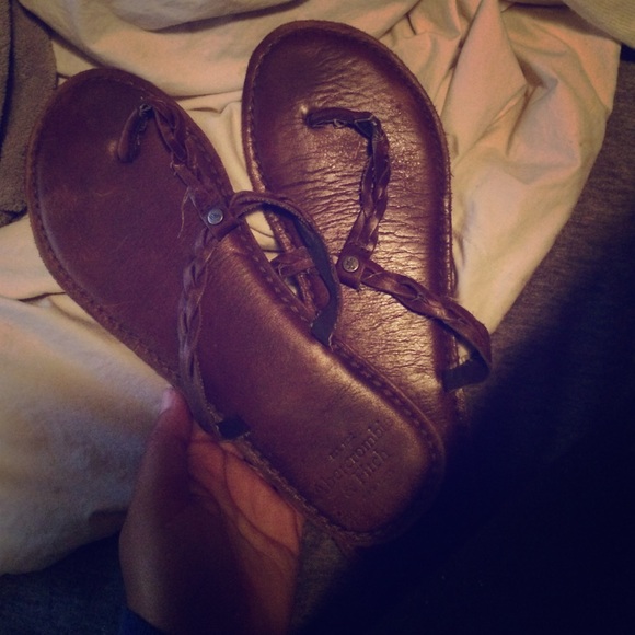 Brown leather flip flops